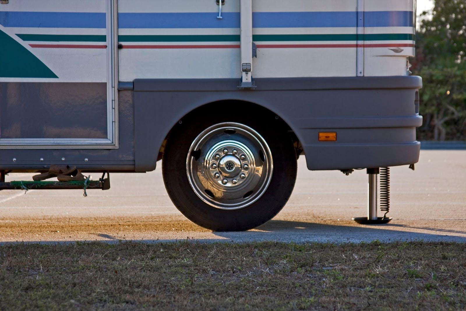 Close-up of an RV tire mounted on a wheel showcasing the tread pattern and rim details